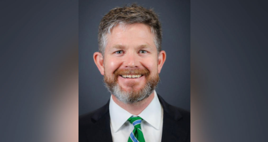 Headshot of Dr. Bailey - looking at camera smiling.