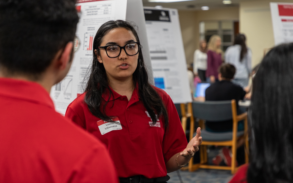 student discussing project