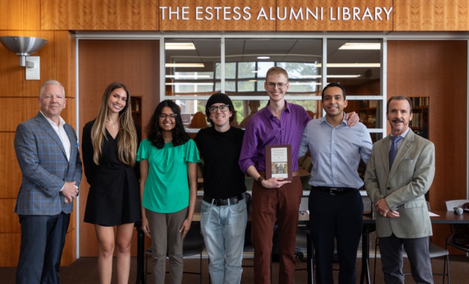 group of students posing in front of estess library