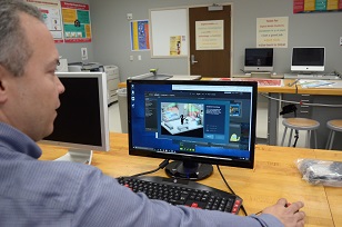 A man wokring on computer